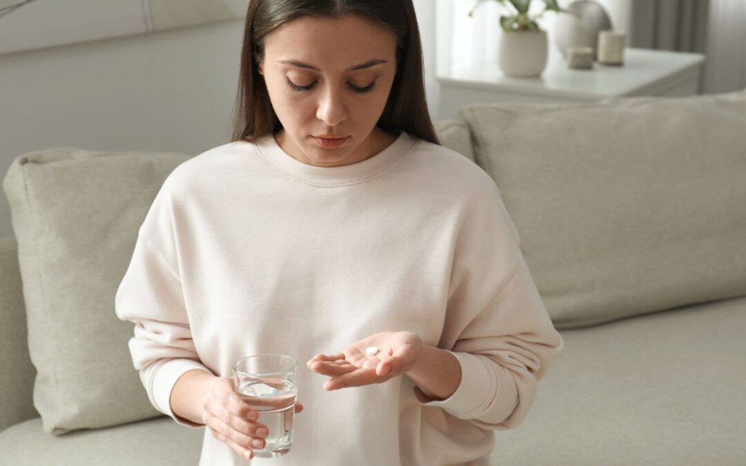 Woman looking at abortion pill