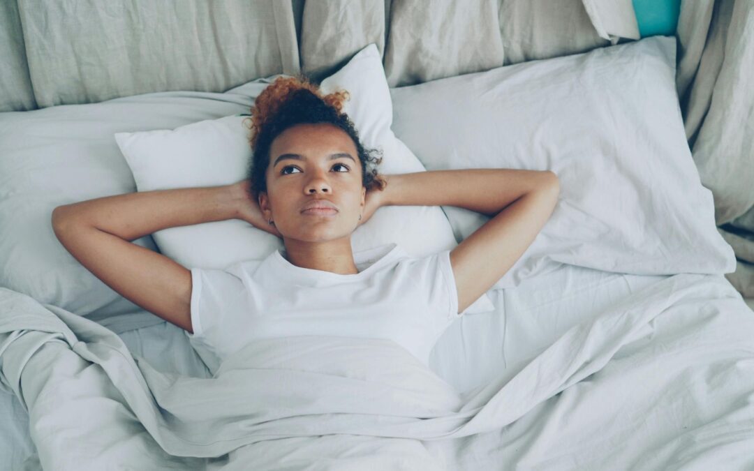 young woman laying in bed